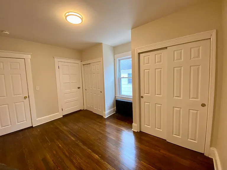 master bedroom with his-n-hers closets and full bath