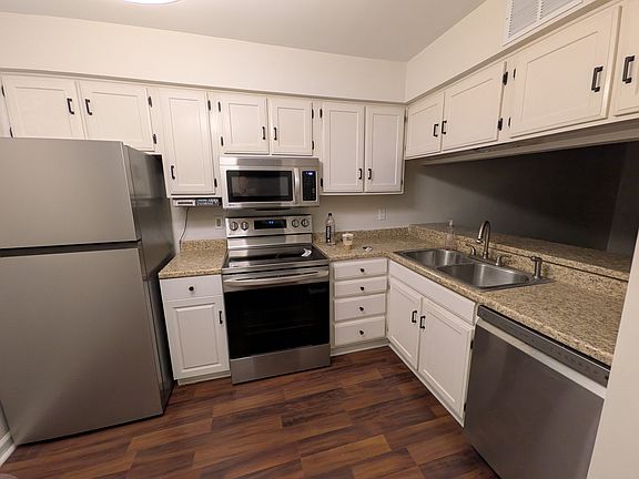 Kitchen with brand new refrigerator