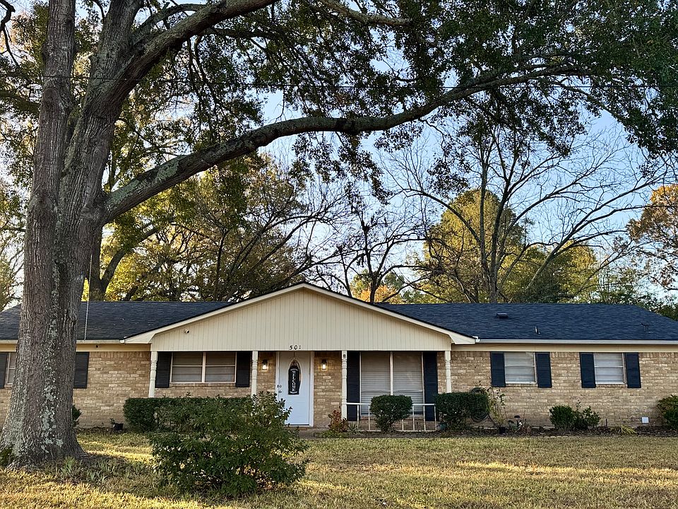 Front/Outside Photo: "Spacious front yard with large driveway and dedicated parking."