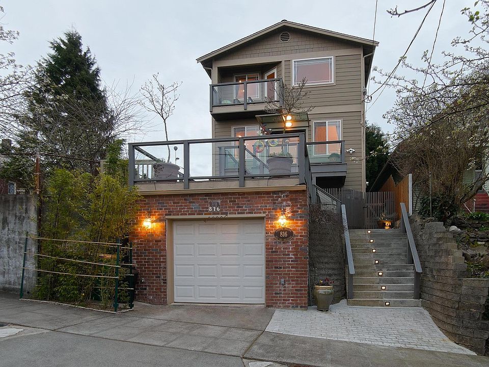 The concrete stairwell leads to your own private entrance on the right side of the house. The deck adjacent to the stairs is a terrific open space to enjoy all the beautiful weather Seattle has to offer as well!