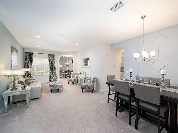 The versatile living room may be used for formal or casual living - Williamson II home plan by Highl