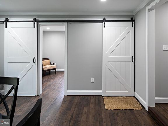 DOUBLE BARN DOORS SEPARATES FAM RM FROM OFC