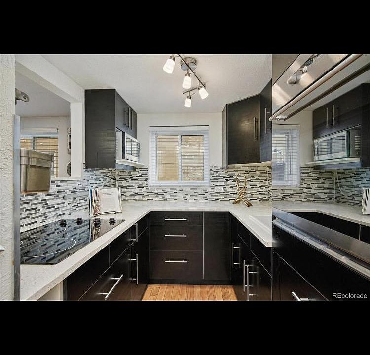Newly remodeled state of the art European design kitchen including electric cook top, wall oven, sleek wall-to-wall spacious kitchen drawers & cabinets, built-in microwave oven and accent lighting. Adjacent eat-in dining space provides for a warm, inviti