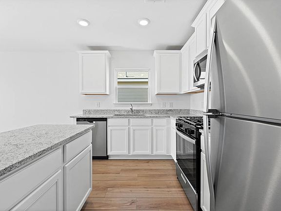 The kitchen comes with stainless steel appliances at no extra costs!