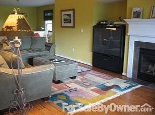 Main Level Living Room
						:
						Large upstairs living room with fireplace. New hardwood floors on main level.