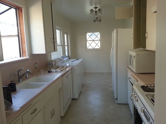 Kitchen with appliances and new tile floor