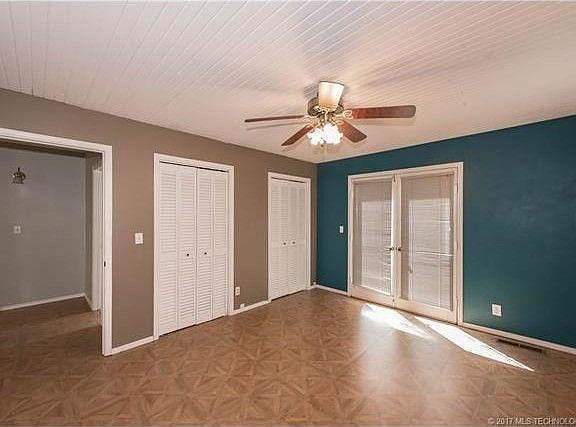 upstairs bedroom with large balcony