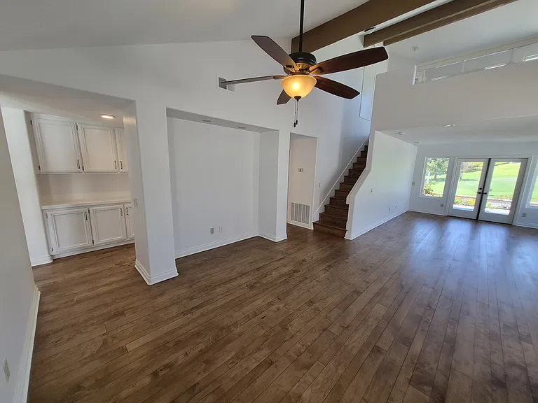Main living area. Upstairs loft. Hallway with storage.