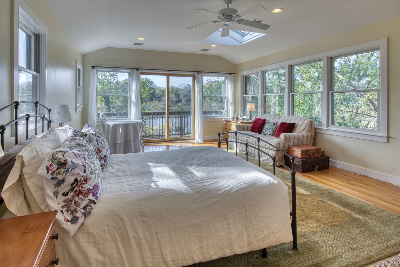 Primary ensuite with waterside balcony deck