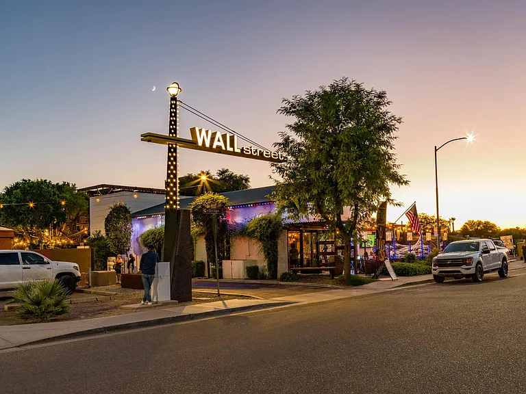 Visit nearby Wall Street with local restaurants, evening lights, and a walkable atmosphere that comes alive after sunset.