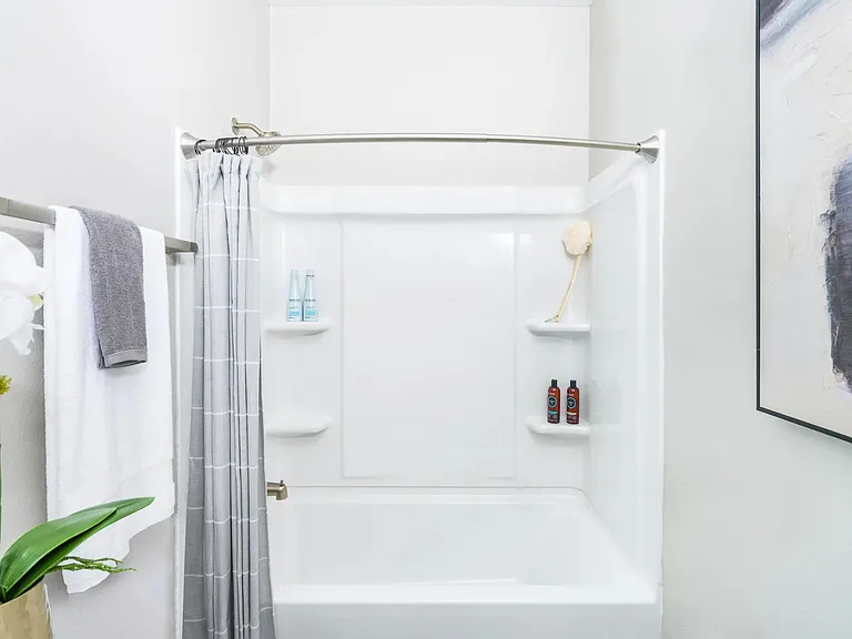 Relax in designer bathrooms featuring spacious garden-style tubs.