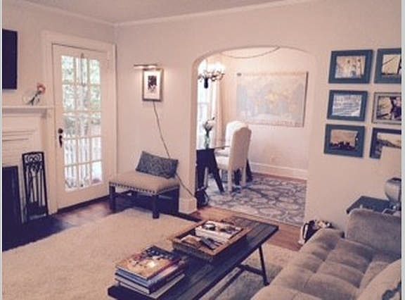 Living room with door to screened in porch