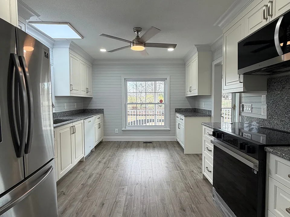 The kitchen boasts new appliances, incredible counterspace, a plethora of cabinet storge and easy access to the living room and dining room.