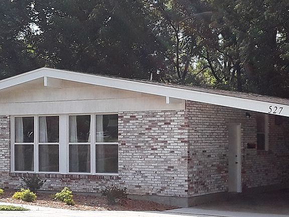 All brick house with 4 car carport