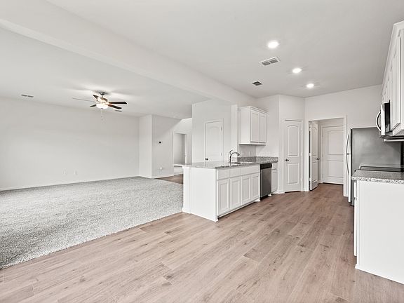 The kitchen of the Cypress sits in between the family room and dining room.