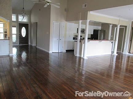Open concept: foyer, bar, large den, dining area, & kitchen, alarm