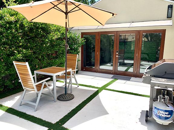 Private garden patio with motion sensor lights.