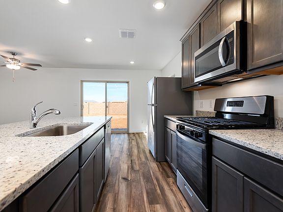 Upgraded stainless-steel appliances are included.