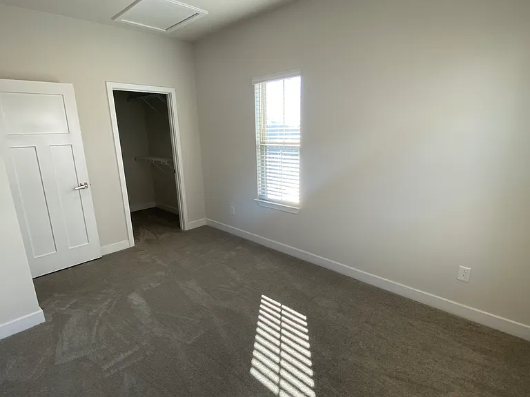 Corner guest bedroom and walk-in closet