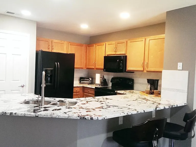 Kitchen with large granite counter