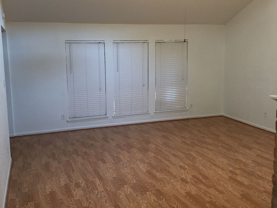 Living room with fireplace and vaulted ceiling