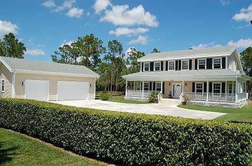 Front elevation with detached garage