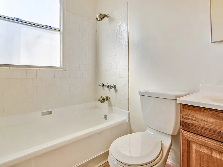 Bathroom With Tub and Shower Combo, Wood Style Flooring
