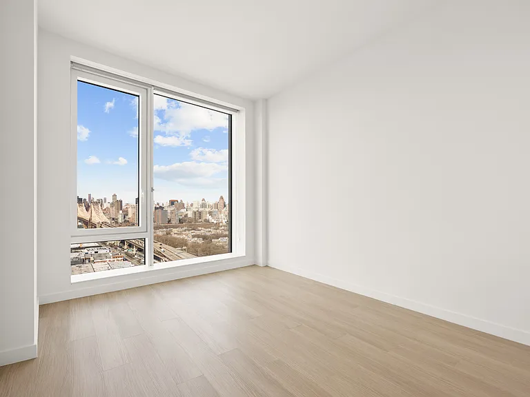 Step into modern living at Aura. This stunning apartment features expansive windows showcasing breathtaking views, flooded with natural light and an open layout ready for your personal touch. Schedule a tour today to see your future home!