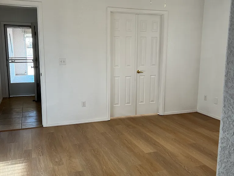 Master bedroom with doors to bonus room
