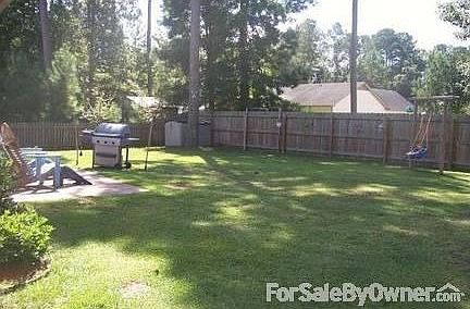 Fenced Back Yard
						:
						12x 12 concrete patio, shade trees, and seasonal flowers add to serenity.