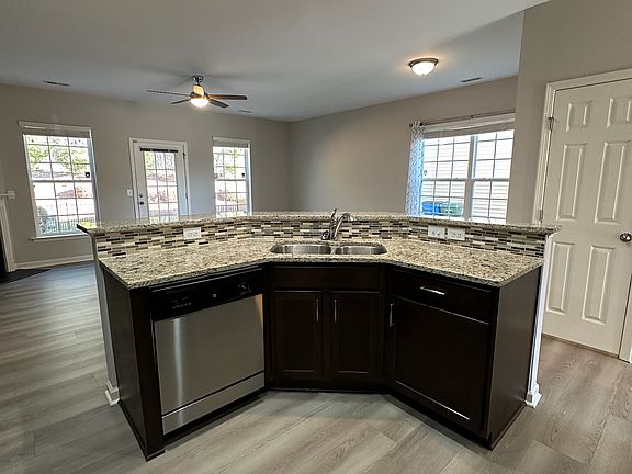 Kitchen island and view of living area