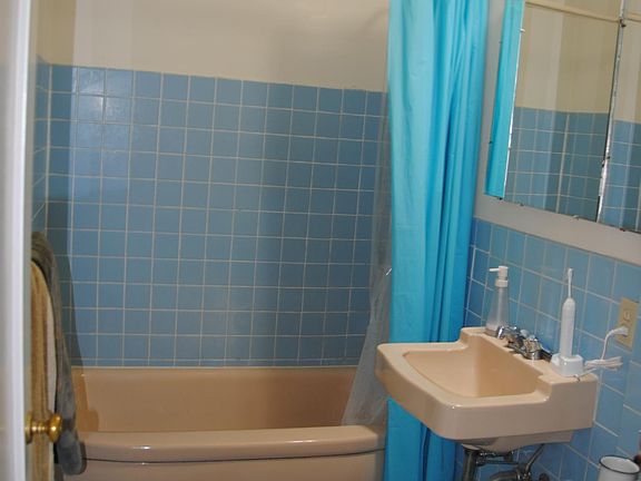 Full bath with shower over tub.