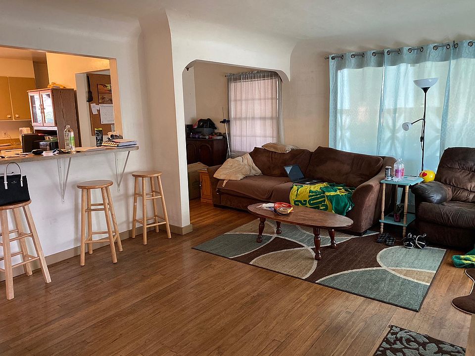 Living room with eating bar open to kitchen.