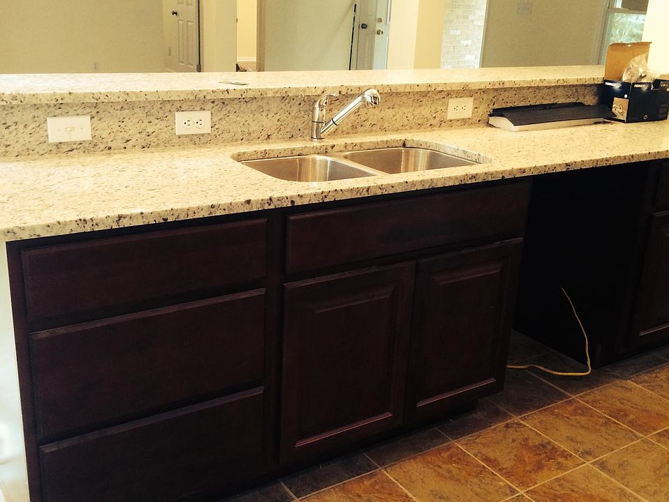 Granite bar leads from kitchen to great room