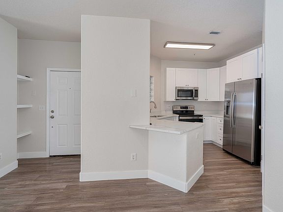 Kitchen includes breakfast bar