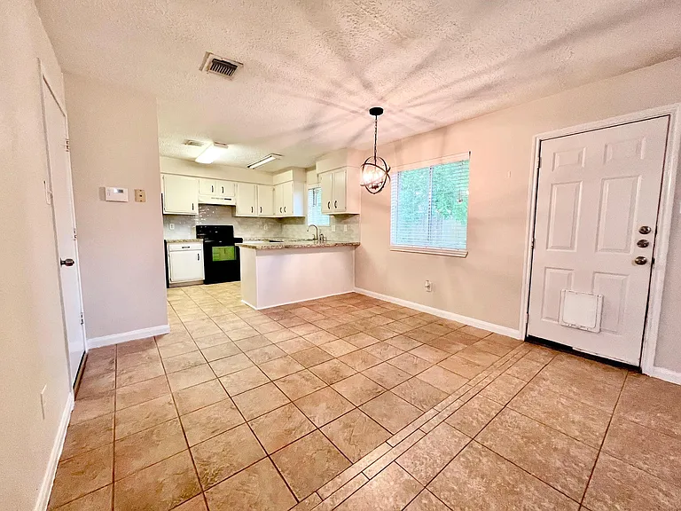 The breakfast area with the window view of the backyard.