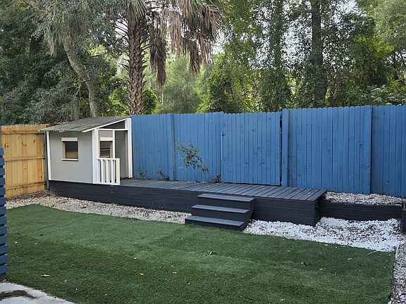 Backyard with Faux Grass, Deck and Playhouse