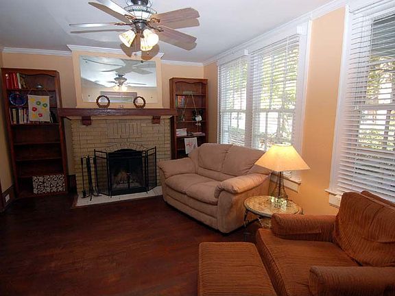 Inviting living room with hardwoods & working fireplace!