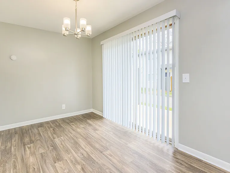 Dining area with hardwood-style flooring