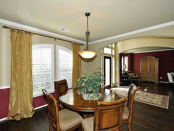 Alternate view of the dining room. There is also plenty of natural light.