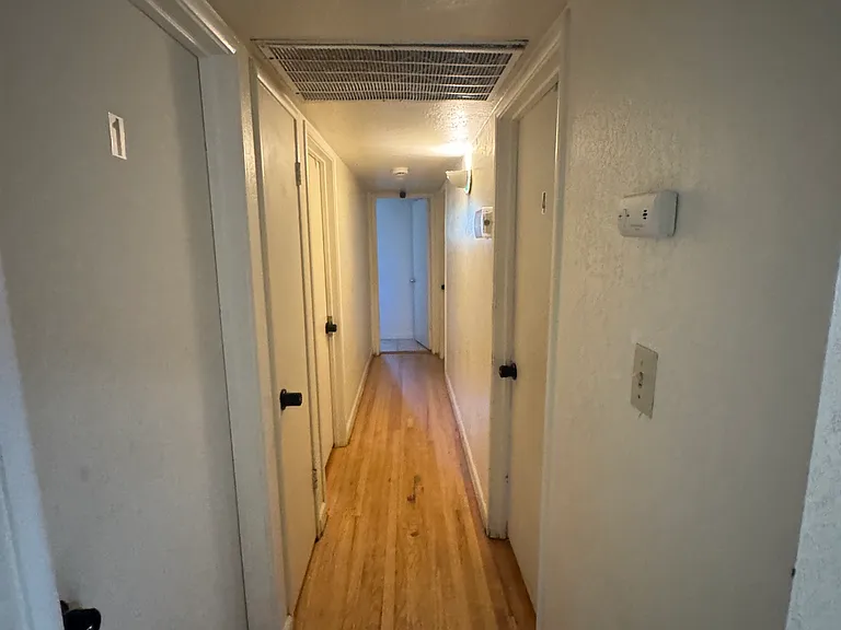 Hallway to 4 bedrooms and 2 bathrooms
Wooden floors in bedrooms