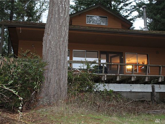 The water view side of this home is completely enclosed by windows to take in the amazing view of the water!