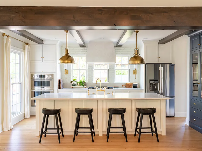 New chef's kitchen features a 10 foot island, double oven, 5 burner stove and large walk-in / hidden pantry.