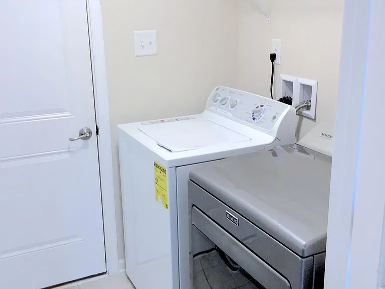 Laundry room on 1st floor with exit to garage