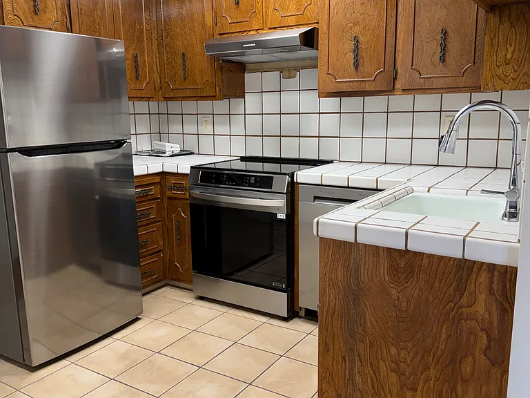 New stainless steel refrigerator, stove/oven, hood dishwasher