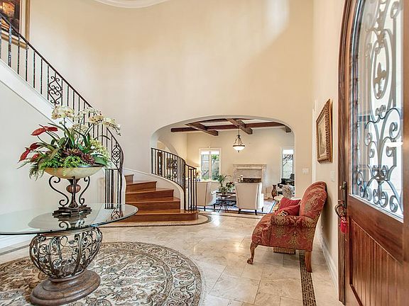Grand formal entry with winding staircase