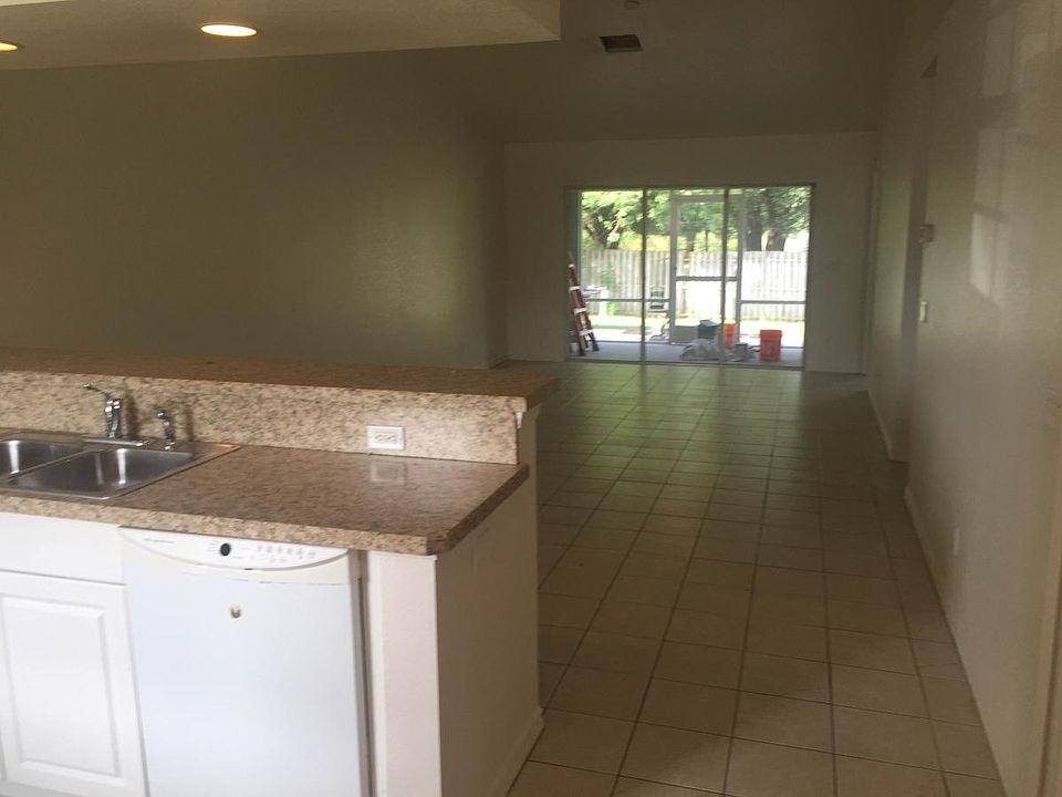Picture from kitchen out through great room to patios