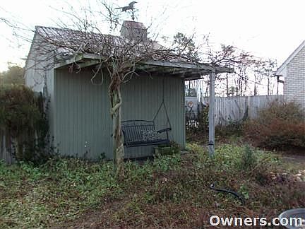Storage Building with Pergola and Wisteria and Trumpet Vines