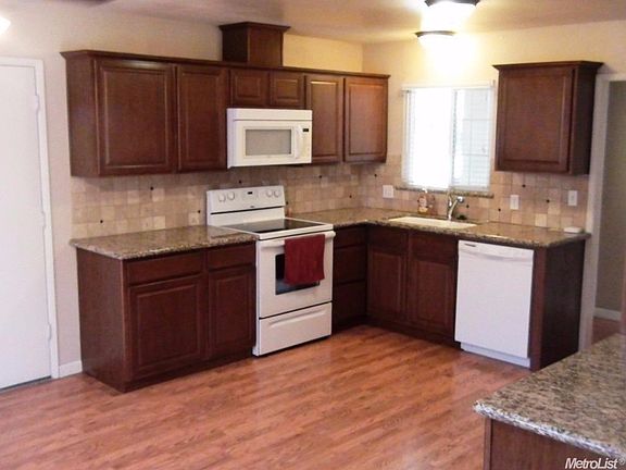 Kitchen has been updated with Granite Counters, backsplash, cabinets and appliances.