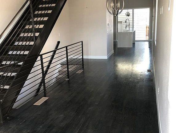 Living, Dining, & Kitchen through back door.